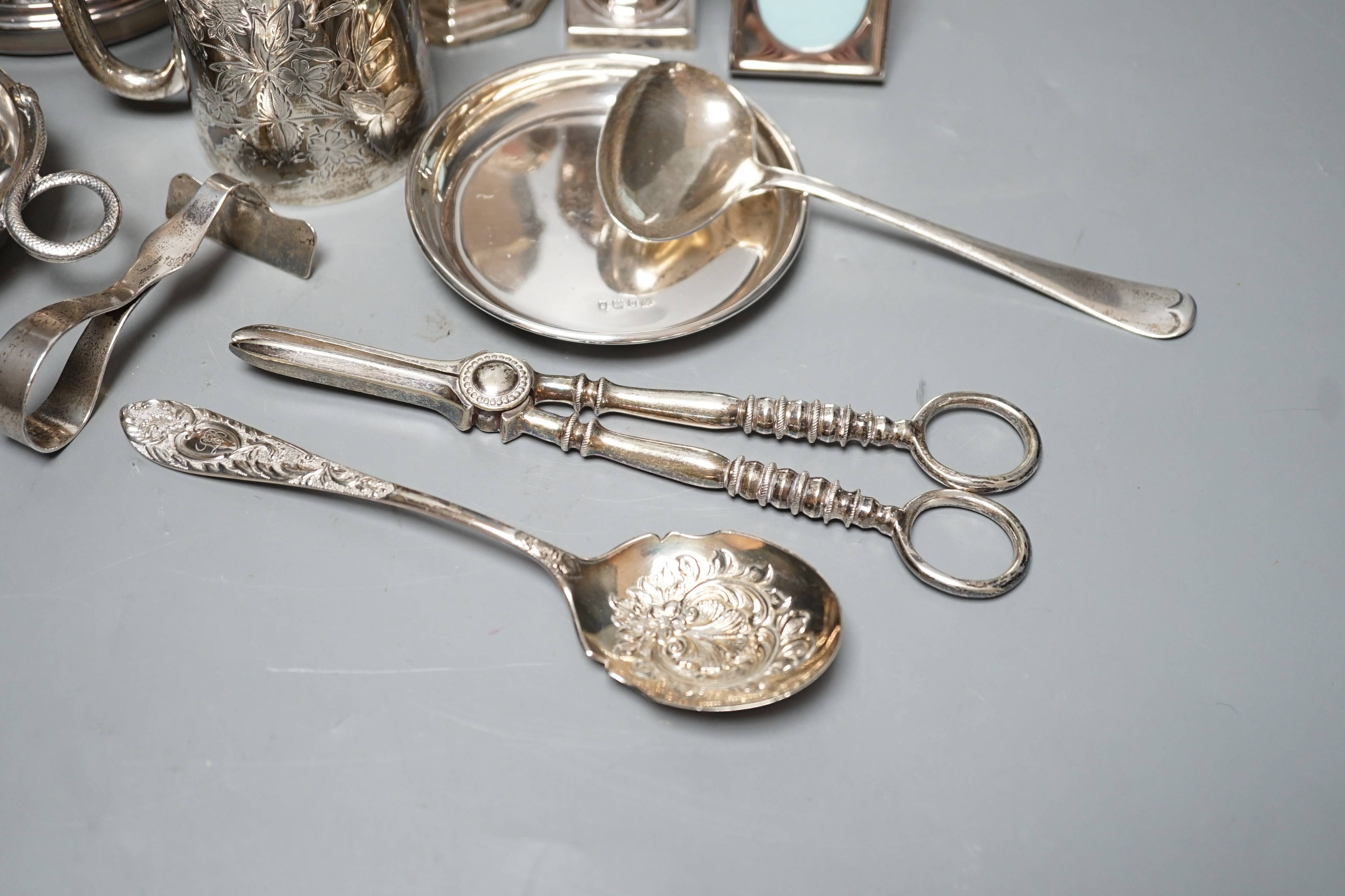 A George III silver vase shaped pepperette, Richard Evans? London, 1788, 88mm, a Victorian silver christening mug, a later silver sugar caster, a French white metal taste vin and other sundry silver and plated items.